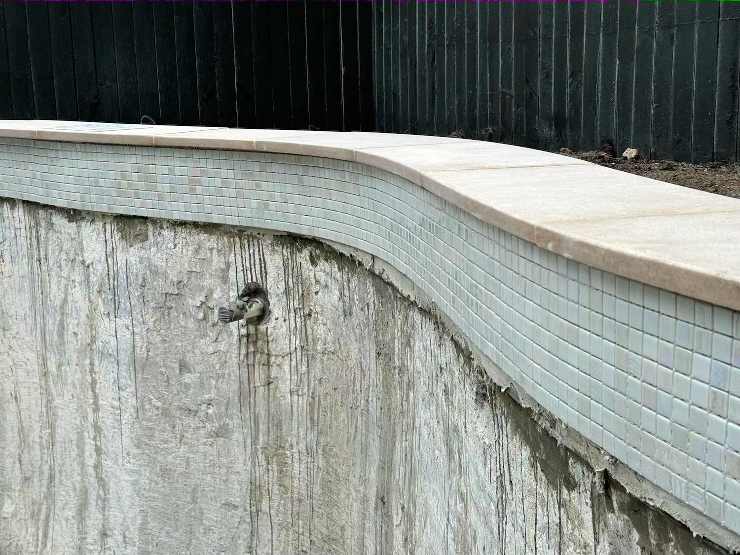 Bella Pools team resurfacing and retiling Mosman plunge pool