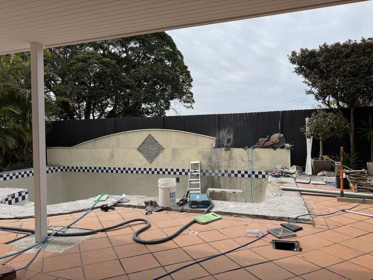 Deck removed to reveal hidden swimming pool shell in Mosman backyard